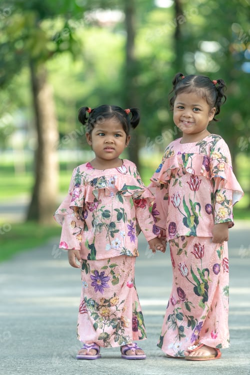Preview: Malay Muslim Little Girls In Their Beautiful Eid Dress. Outdoor Portrait
