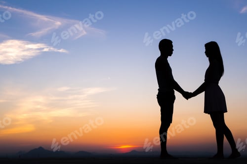 Preview: Silhouette Of Happy Young Couple Hugging Outside At Sunset,Holding Hands