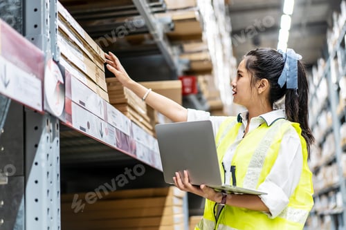 Preview: Portrait Of Smiling Asian Engineer Woman Check Stock Details On Tablet Computer For Checking Boxes