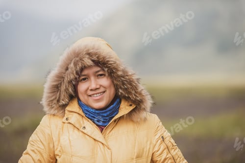 Preview: Smiling Muslim Female Tourist Wearing A Winter Coat.