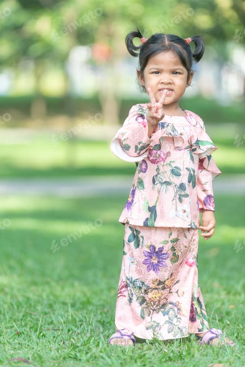 Preview: Cute Malaysian Kid In Eid Costume. Outdoor Portrait.