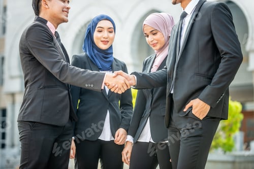 Preview: Welcome Onboard! Muslim Asian Business People Shaking Hands With New Partner, Business Co-Working