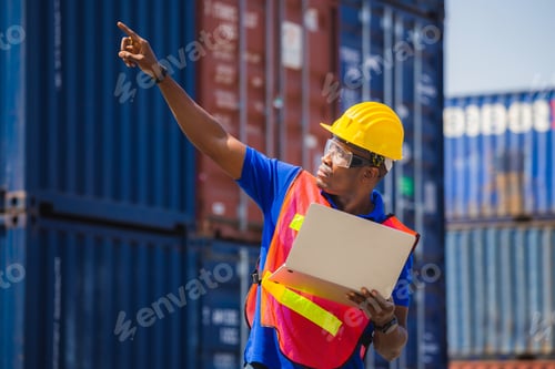 Preview: Worker Man In Hardhat And Safety Vest Holding Laptop And Point To The Sky, Foreman Control Loading
