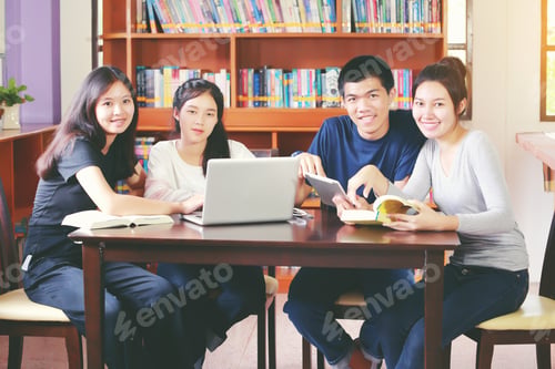 Preview: Happy Young Multiracial Group Of Young University Students Studying With Books And Laptop In