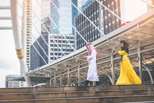 Preview: Young Muslim Business Man Holding Smart Phone And Walking Rapidly To Airport And Young Muslim