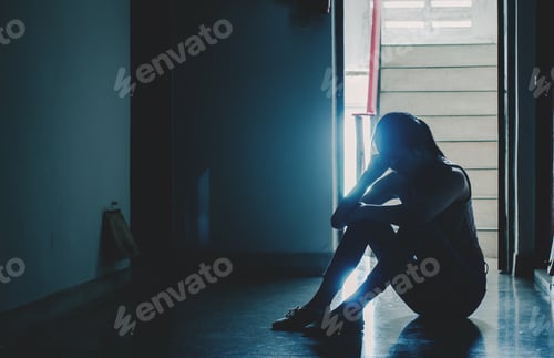 Preview: Silhouette Of Girl Sitting Alone In The Dark,Sad And Serious Women Sitting Hug His Knee Alone Of