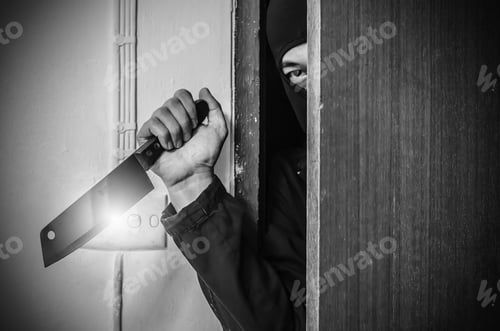 Preview: Stranger Or Robber With Knife In The Room. Someone Holding A Knife In The Shadows Behind A Door.Be