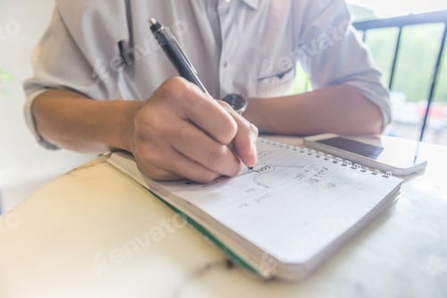 Preview: Close Up Of Young Student Writing Notes