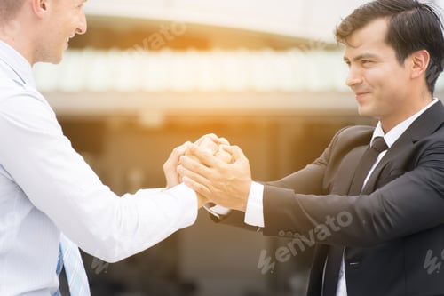 Preview: Businessman In Smart Casual Joining Hands.Businessman Handshake Show Teamwork. Successful Business