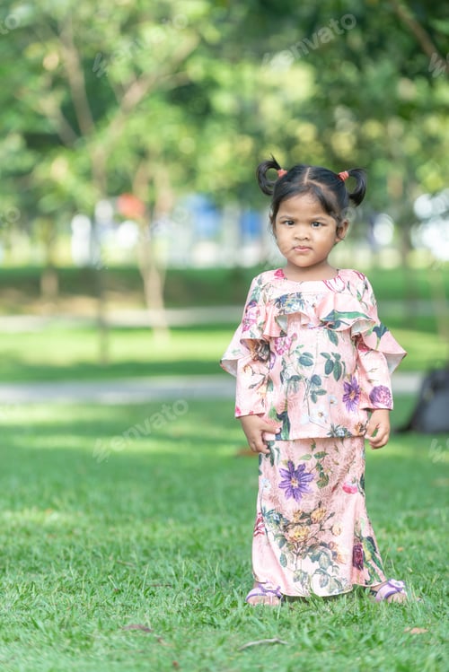 Preview: Cute Malaysian Kid In Eid Costume. Outdoor Portrait.