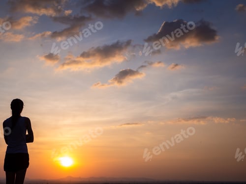 Preview: Shilouette Of Young Woman At Golden Sunset, Thinking,Relaxing And Enjoying Nature With Copy Space.