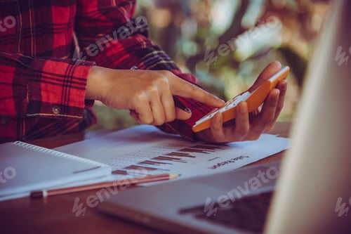 Preview: Hands Of Businessman Working On Laptop Computer With Data Charts