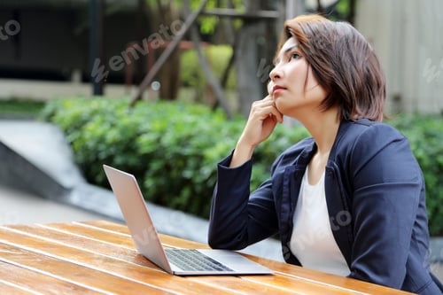 Preview: Freelance Asian Woman Look Up For Thinking Idea And Working At Home. Business Woman Working On