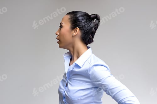 Preview: Woman in Profile Wearing a Blue Shirt