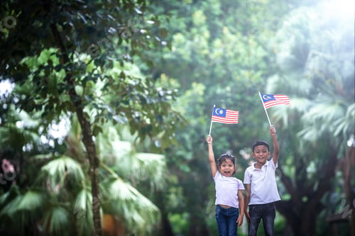 Preview: Boy And Girl With Malaysia Flag. Independence Day Concept. Outdoor Setting