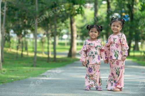 Preview: Malay Muslim Little Girls In Their Beautiful Eid Dress. Outdoor Portrait