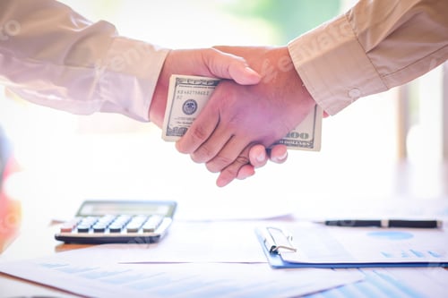 Preview: Cropped Image Of Businessman Bribing Partner While Shaking Hand Outdoors