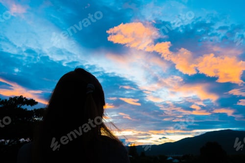 Preview: Girl Looking At A Beautiful Sky Before Sunset