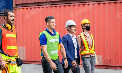 Preview: Engineer And Worker Team Walking In The Cargo Container