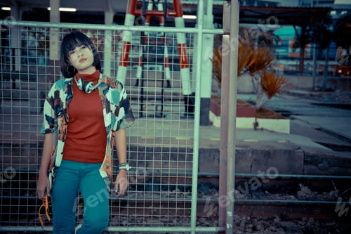 Preview: Portrait Of Asian Hipster Girl On Sunset At Railway Vintage Style,Grain And Noise Has Been Added To