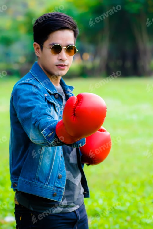 Preview: Sport Man With Boxing Gloves To Fight In Business.