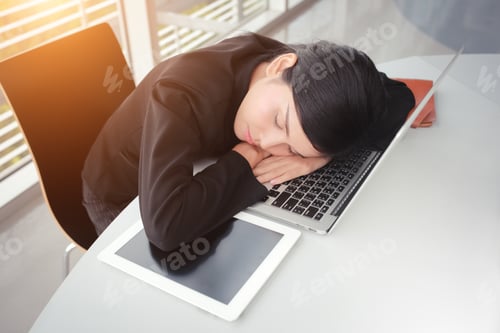Preview: Sleeping Businesswomen On Notebook With Sun Light Effect