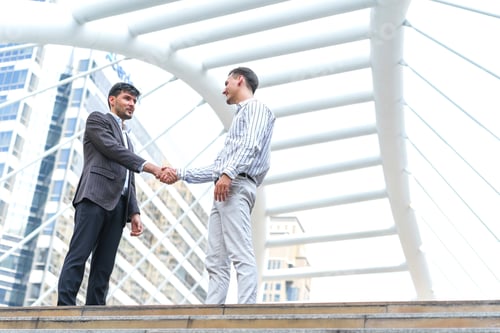 Preview: Two Business Man Meeting Partnership And Shaking Hands For Deal Success At Site Outdoors.