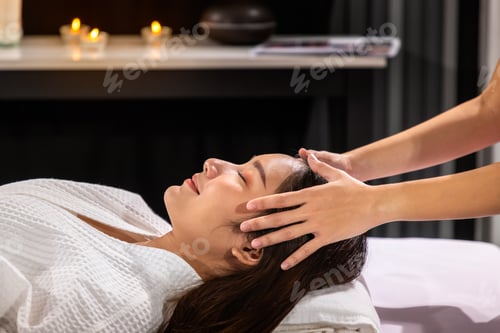 Preview: Beautiful Young Asian Woman Enjoy Head Massage In Tranquil Spa Salon, With Candle.