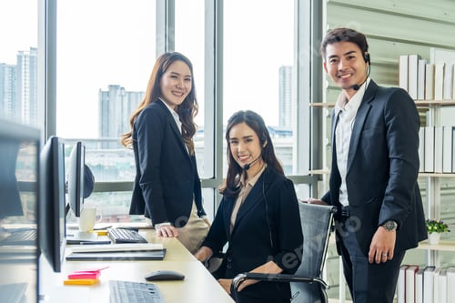 Preview: Handsome And Beautiful Of Call Center Or Customer Support Operator Smiling In Headphones In Office