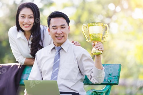 Preview: Happy Asian Business Couple Associates After Receiving Awards From Work In The Park.