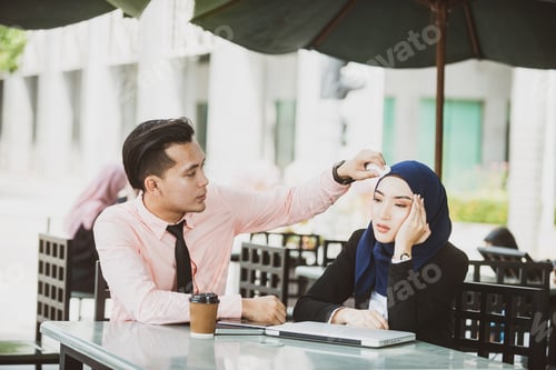 Preview: Girlfriend Having Migraine, Boyfriend Worry. Health Care Concept. Muslim Couple