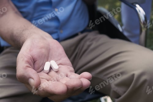 Preview: Hand Of Senior Man Give A Medecine For Health Care