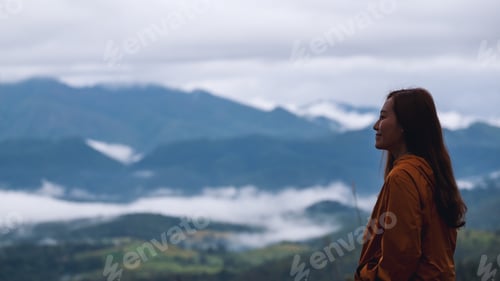 Preview: Portrait Image Of A Female Traveler Looking At A Beautiful Foggy Mountain And Nature View