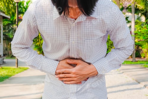 Preview: Business Man In Office Uniform Having A Stomachache In The Park / Food Poisoning / Stomach Problems