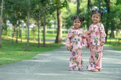 Preview: Malay Muslim Little Girls In Their Beautiful Eid Dress. Outdoor Portrait