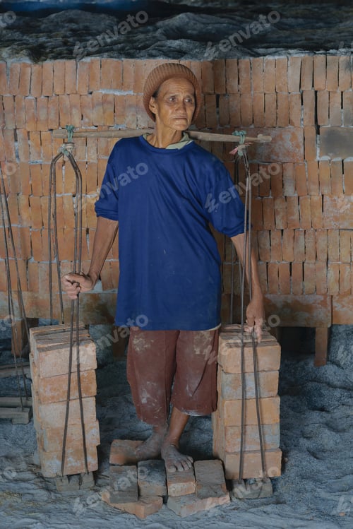 Preview: Photo Of Asian Elderly Woman With Fatigue From Hard Work.