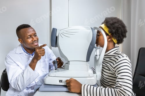 Preview: African Young Woman Girl Doing Eye Test Checking Examination Using Autorefractor In Clinic Or