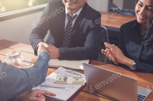Preview: Businessman Handshake After A Successful Business Meeting.Business Negotiations And Agreements