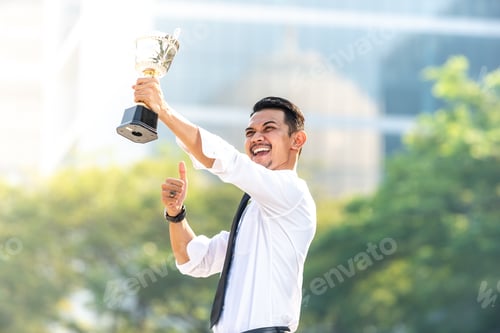Preview: Malay Businessman Wins A Trophy. Top Employee Concept