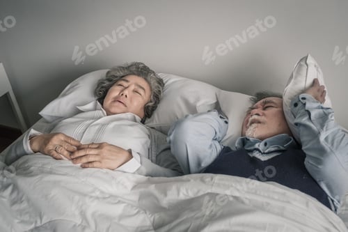 Preview: Elderly Couple Caucasian Senior Man And Woman Sleep On Bed And Snoring In White Blanket In Bedroom