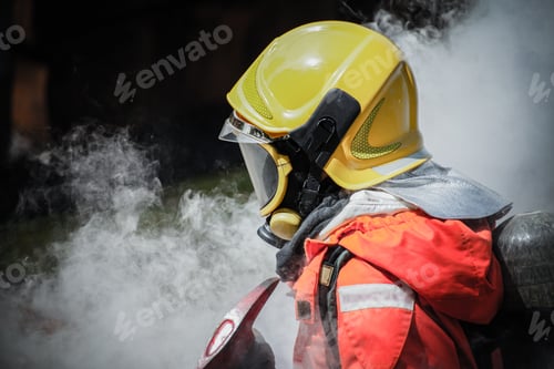 Preview: Firefighter Wearing Safety Suit And Walking To Fire Damage Area With Axe For Fire Fighting, Fire