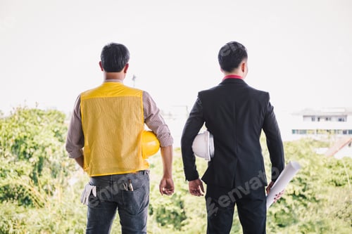 Preview: Labor And Engineer Standing With Safety Helmet On Old Buildings In Their Job Site.
