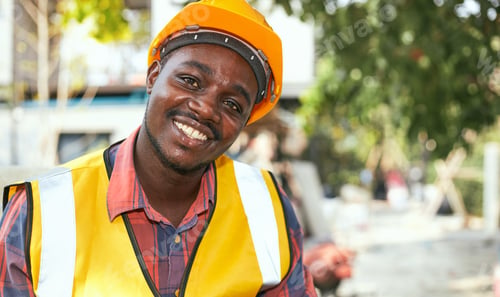 Preview: Black Laborers Wearing Protective Clothing And Yellow Helmets, Smiling Happily Inside The