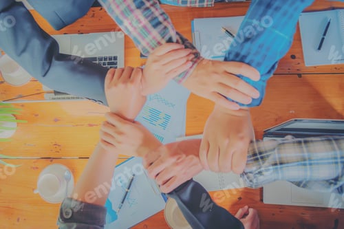 Preview: Close Up Of Young People Putting Their Hands Together. Team With Stack Of Hands Showing Unity And