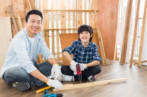 Preview: Asian Adorable Father And Son Helped To Do Woodwork At Home.