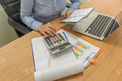 Preview: Young Asian Businesswoman Calculate Sales On The Calculator