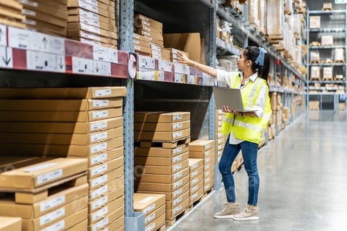 Preview: Asian Engineer Woman Check Stock Details On Tablet Computer For Checking Boxes With Logistics On