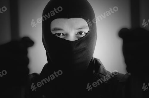 Preview: Bandit Wearing A Mask Is Agitated Prisoner In Jail Holding Bars Isolated On White Background