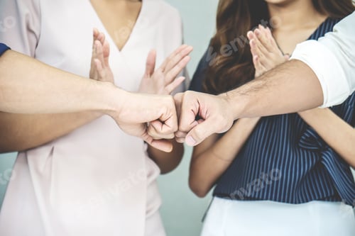 Preview: Team Of Business People Negotiating An Agreement Closing The Deal With Put Fists, Congratulations