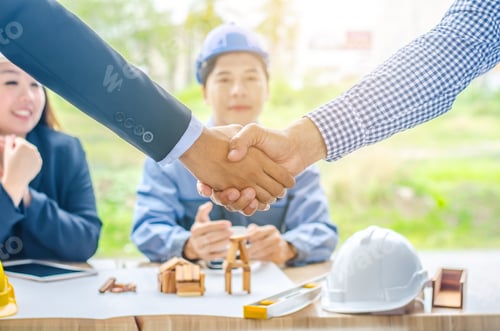 Preview: Successful Businessmen Architects Shaking Hands. Four Businessman Architect Met In The Office To